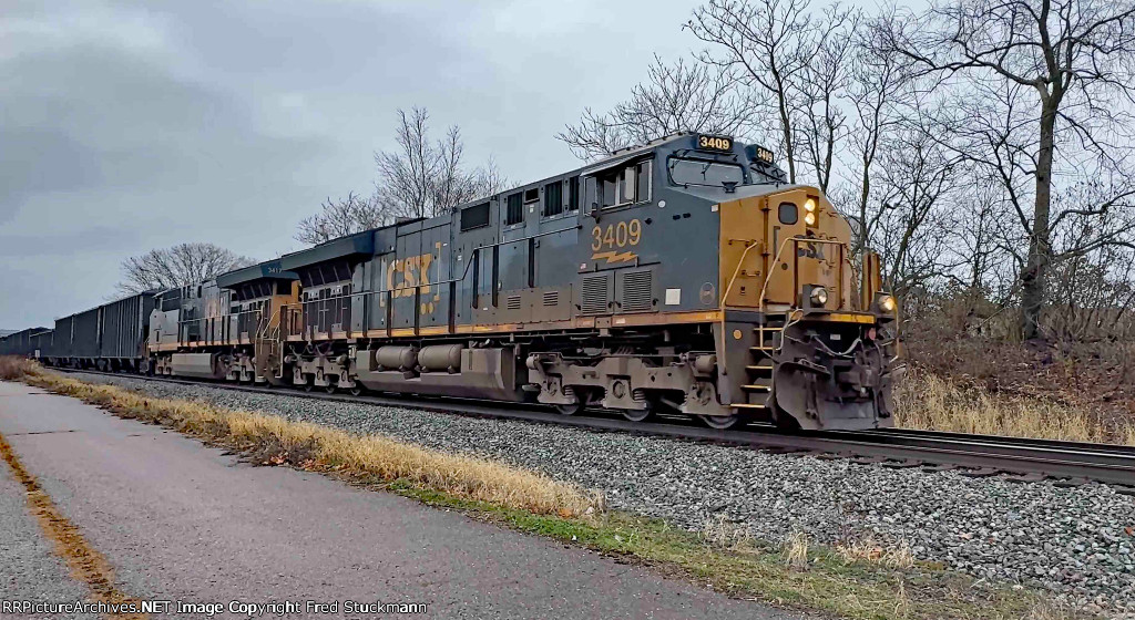 CSX 3409 leads B157, loaded Coke.